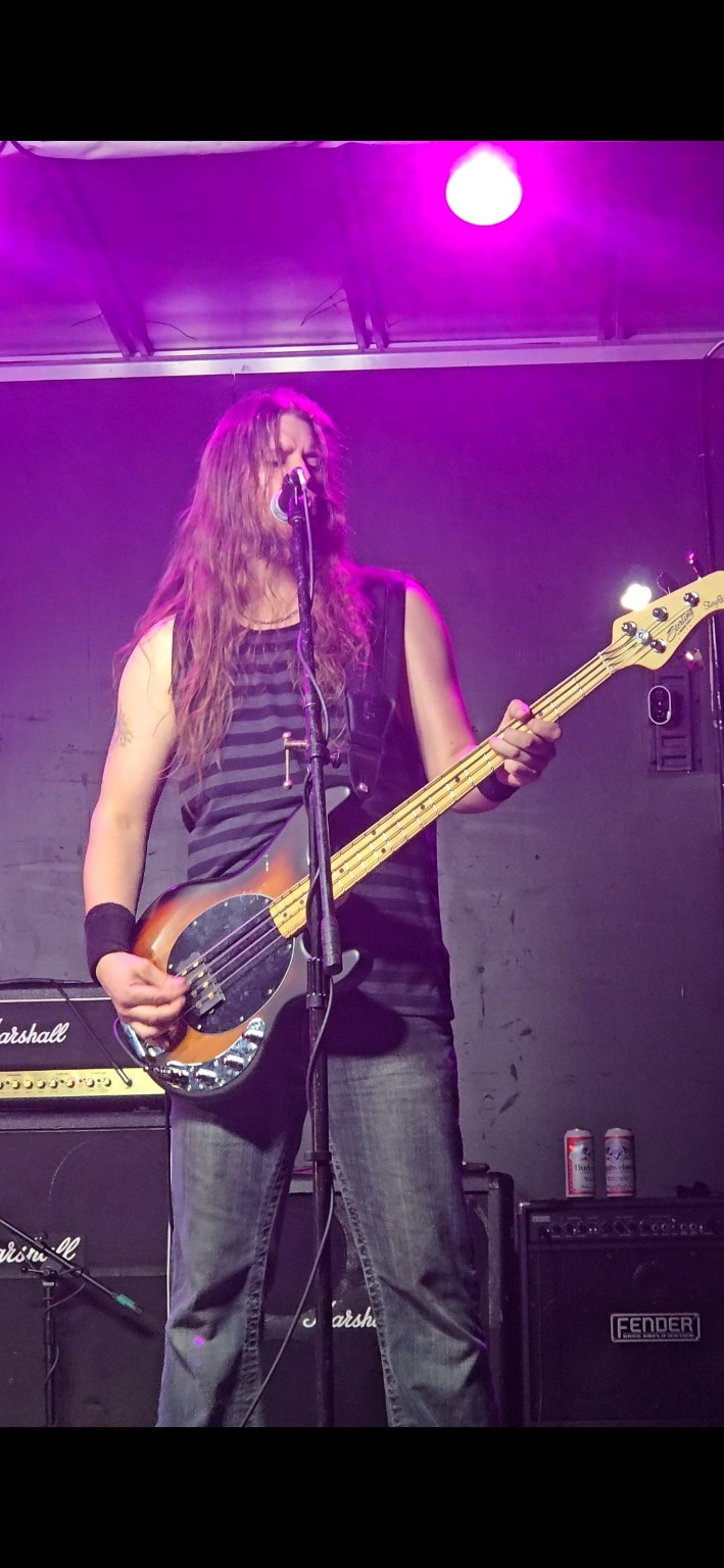 AC/DC ERAS bassist on stage